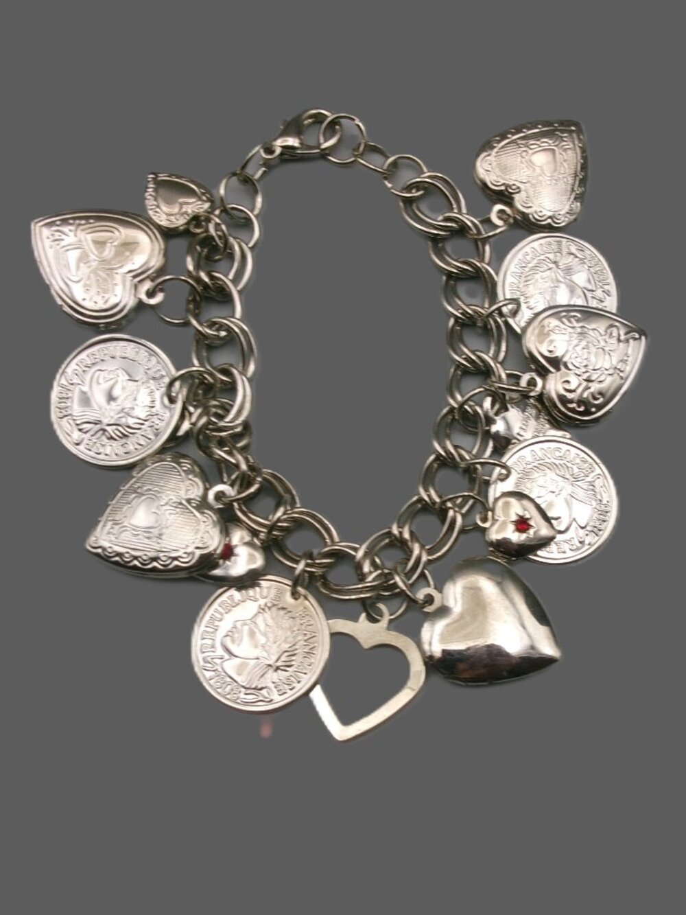 Etched Hearts, Lockets and Faux Coins Silver Tone Charm Bracelet